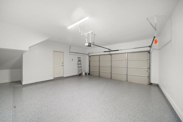 garage featuring baseboards and a garage door opener