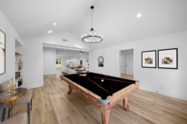 rec room with light wood finished floors, visible vents, vaulted ceiling, and a ceiling fan