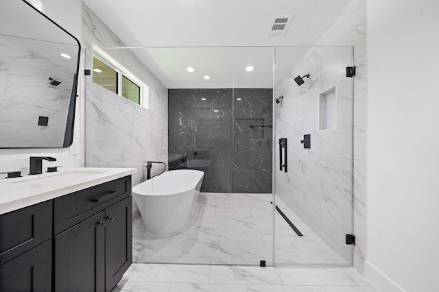 bathroom with a soaking tub, a marble finish shower, visible vents, and vanity