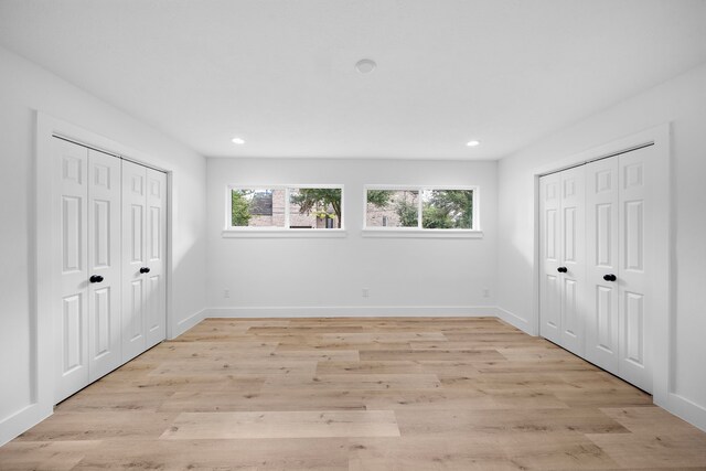 4102 Levonshire Dr, Houston, TX 77025 - unfurnished bedroom featuring recessed lighting, light wood-type flooring, baseboards, and multiple closets