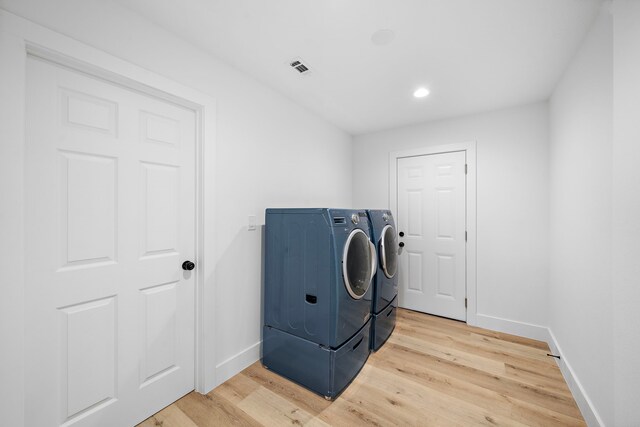 4102 Levonshire Dr, Houston, TX 77025 - washroom with washer and dryer, baseboards, light wood-style floors, and recessed lighting