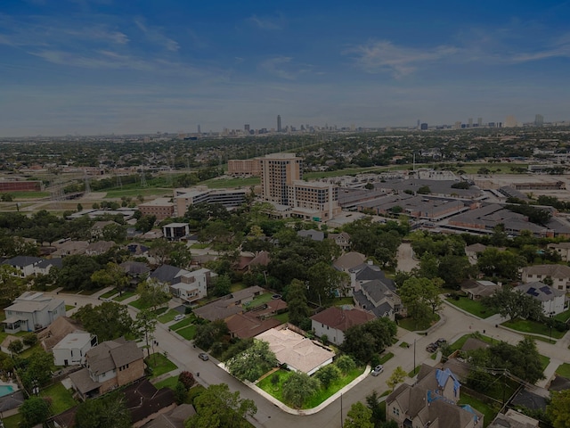 birds eye view of property with a view of city