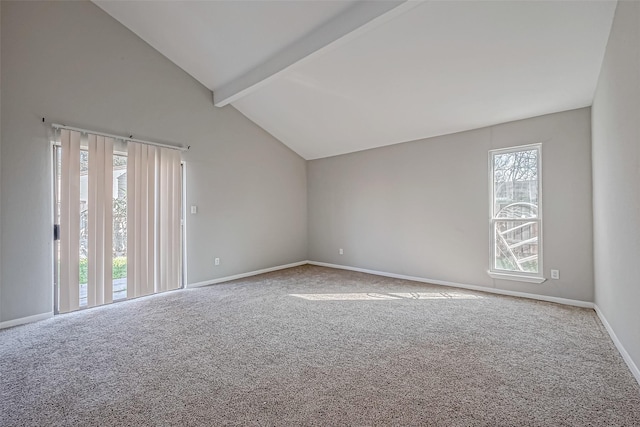 empty room with beamed ceiling, high vaulted ceiling, and carpet