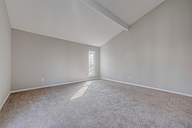 unfurnished room with carpet, high vaulted ceiling, and beam ceiling