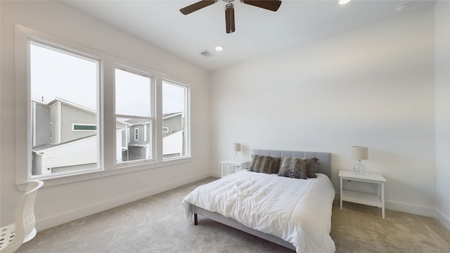 carpeted bedroom featuring recessed lighting, visible vents, ceiling fan, and baseboards