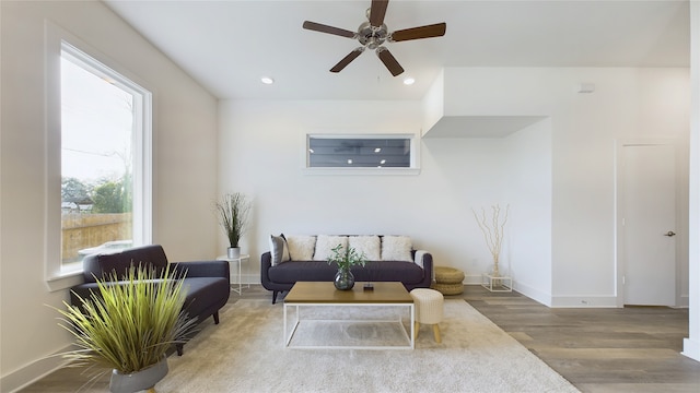 living room with recessed lighting, ceiling fan, baseboards, and wood finished floors