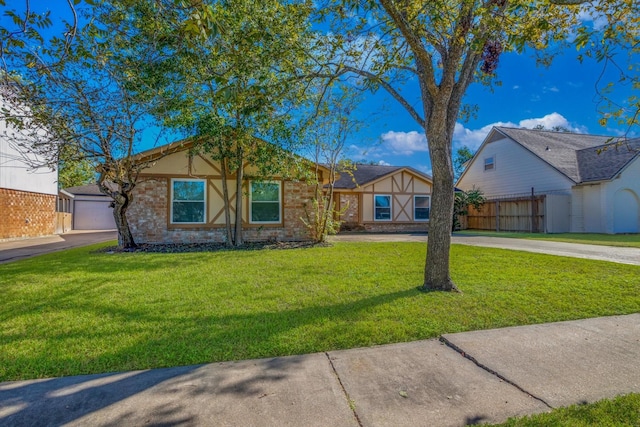 ranch-style house with a garage, a front yard, fence, and driveway