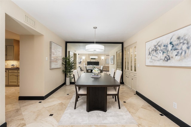 18138 Bal Harbour Dr, Houston, TX 77058 - dining space with baseboards and light tile patterned floors