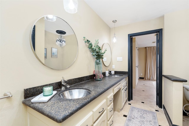 bathroom with double vanity and a sink