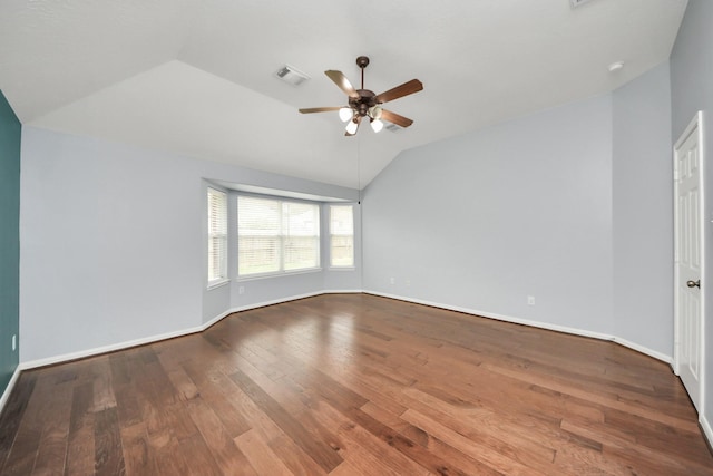 unfurnished room featuring baseboards, visible vents, lofted ceiling, ceiling fan, and wood finished floors