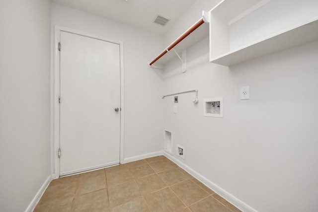 laundry room with laundry area, light tile patterned floors, visible vents, hookup for a gas dryer, and hookup for an electric dryer