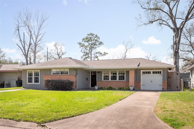 ranch-style house featuring a garage and a front lawn