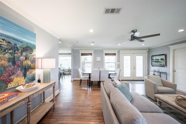 living room featuring ceiling fan, ornamental molding, dark hardwood / wood-style floors, and french doors