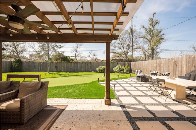 view of patio featuring a fire pit and ceiling fan