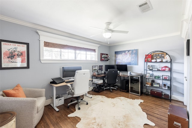 home office featuring ceiling fan, ornamental molding, and dark wood-type flooring