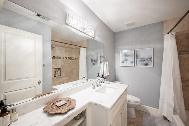 full bathroom featuring toilet, vanity, tile patterned flooring, and shower / bath combo with shower curtain