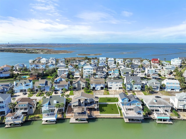 bird's eye view featuring a water view and a residential view