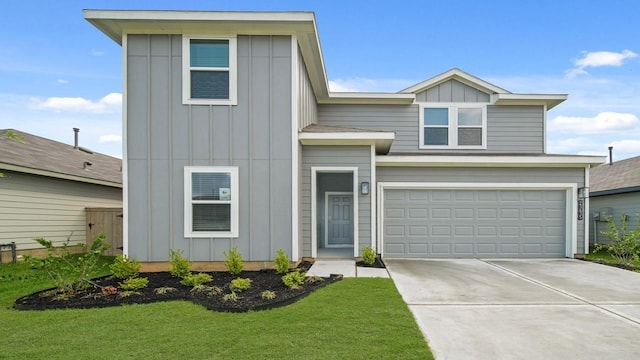 view of front of property featuring concrete driveway, a front lawn, board and batten siding, and a garage