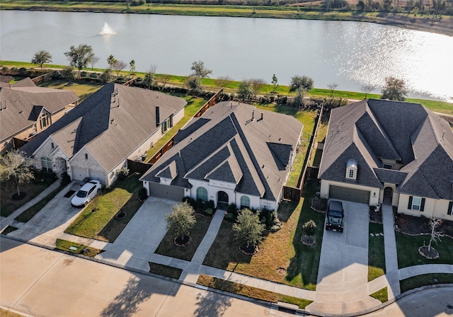 aerial view with a water view and a residential view