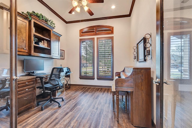 home office with dark wood-style flooring, ornamental molding, baseboards, and ceiling fan