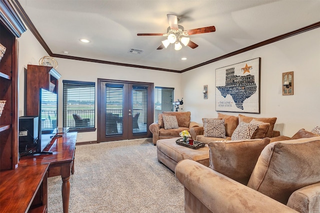 living area with carpet floors, ornamental molding, french doors, and visible vents