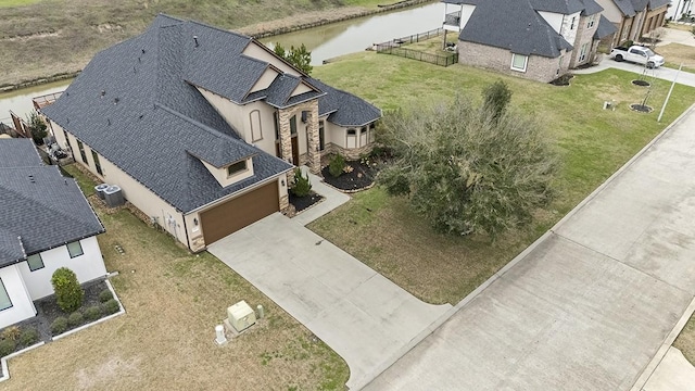 birds eye view of property with a water view