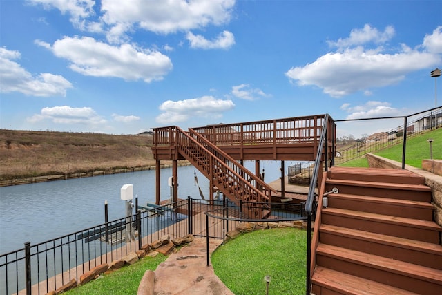 dock area with stairs and a water view