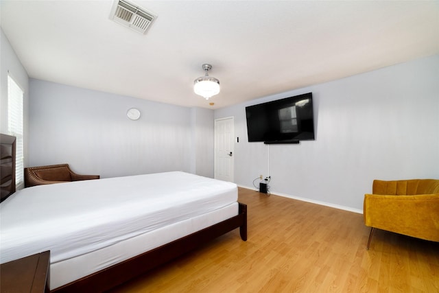 bedroom with light wood-type flooring