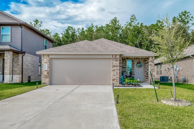 view of front of house with a front yard, a garage, and central air condition unit