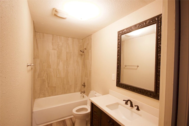 8030 Lawler St, Houston, TX 77051 - full bathroom with a textured ceiling, tiled shower / bath combo, vanity, and toilet
