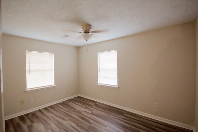 8030 Lawler St, Houston, TX 77051 - spare room featuring a textured ceiling, ceiling fan, and hardwood / wood-style flooring