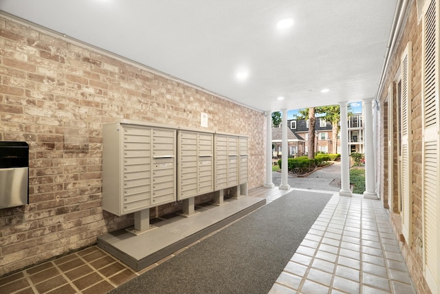 surrounding community featuring ornate columns and mail boxes