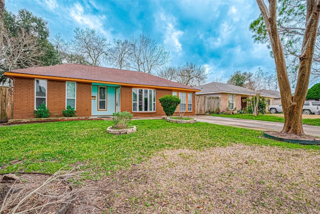 ranch-style house with a front lawn