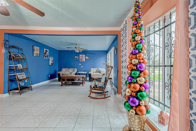 tiled living room with a textured ceiling, crown molding, and ceiling fan
