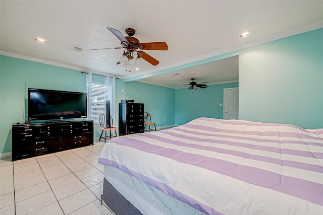 bedroom featuring ceiling fan, light tile patterned floors, and ornamental molding