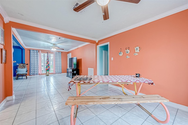 game room featuring ceiling fan, light tile patterned floors, and crown molding