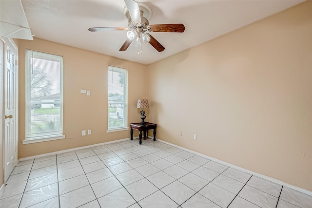 unfurnished room with ceiling fan and light tile patterned floors