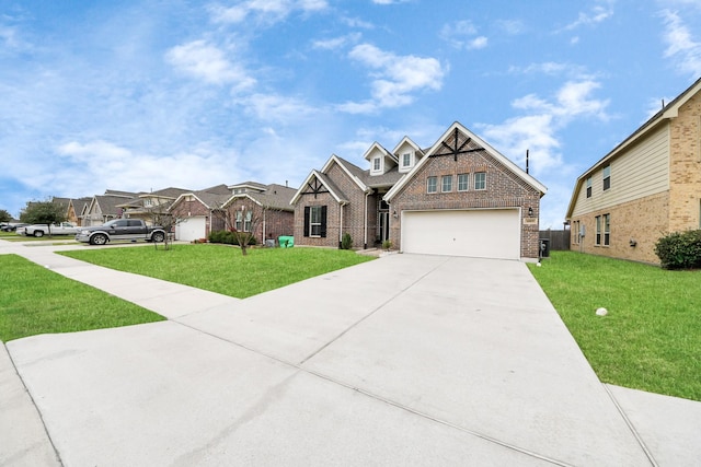 view of front facade with a front yard, concrete driveway, and brick siding