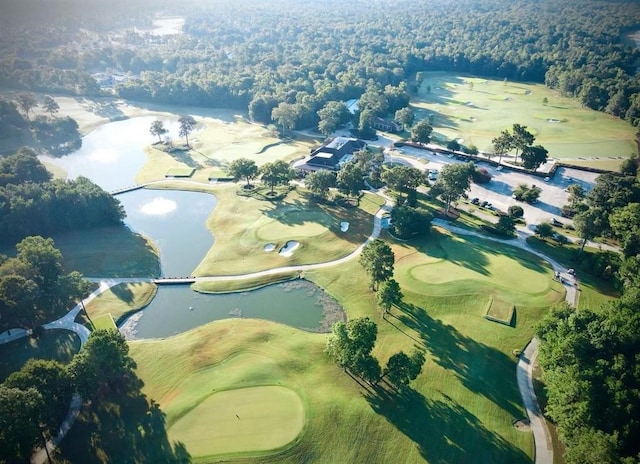 bird's eye view featuring view of golf course and a water view