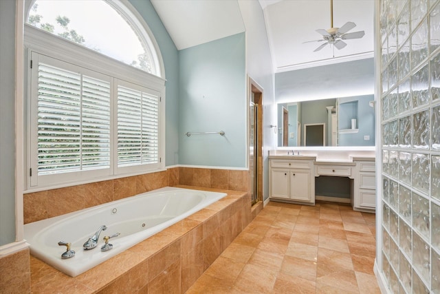 full bath featuring lofted ceiling, a stall shower, a healthy amount of sunlight, and vanity