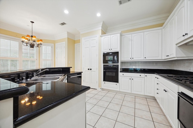 kitchen featuring black appliances, dark countertops, and white cabinets