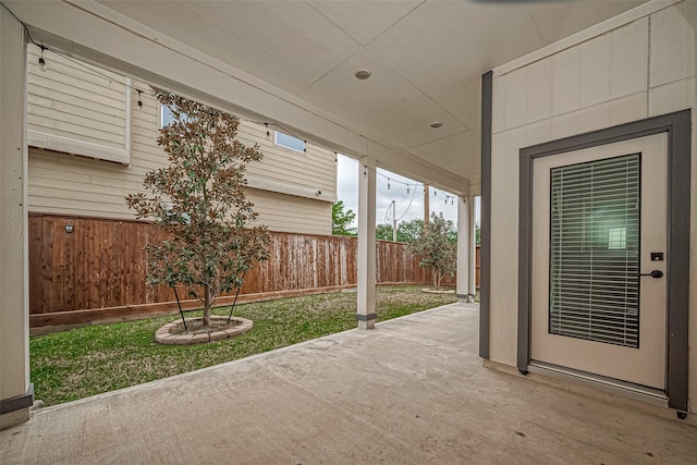 view of patio / terrace featuring fence