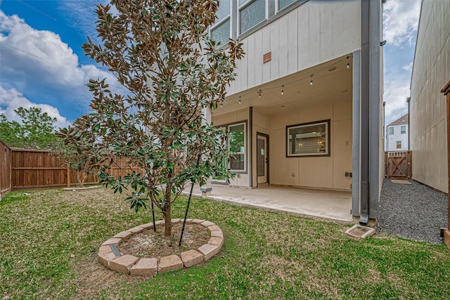 view of yard with a patio and a fenced backyard