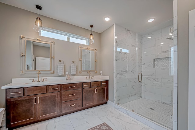 full bath with marble finish floor, double vanity, a sink, and a marble finish shower