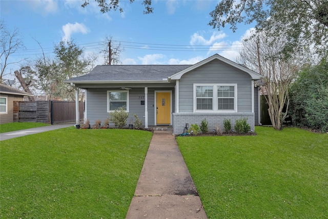 ranch-style house featuring a porch and a front yard