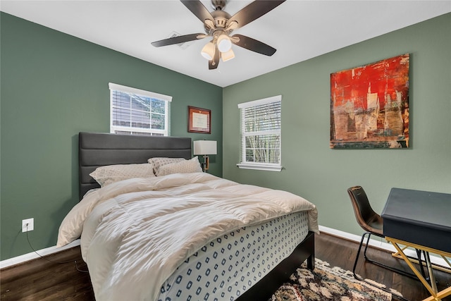 bedroom featuring ceiling fan and dark hardwood / wood-style floors