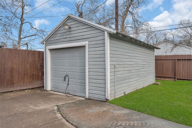 garage featuring a lawn