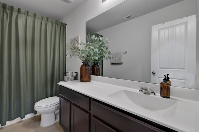 full bath with vanity, toilet, visible vents, and wood finished floors