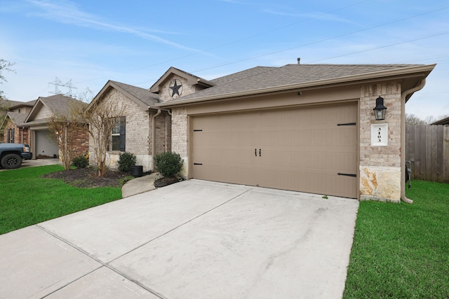 single story home featuring roof with shingles, concrete driveway, a garage, and a front yard