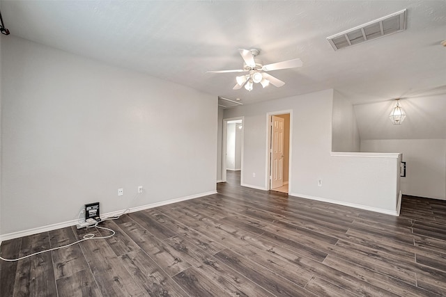 interior space featuring baseboards, ceiling fan, visible vents, and dark wood-type flooring